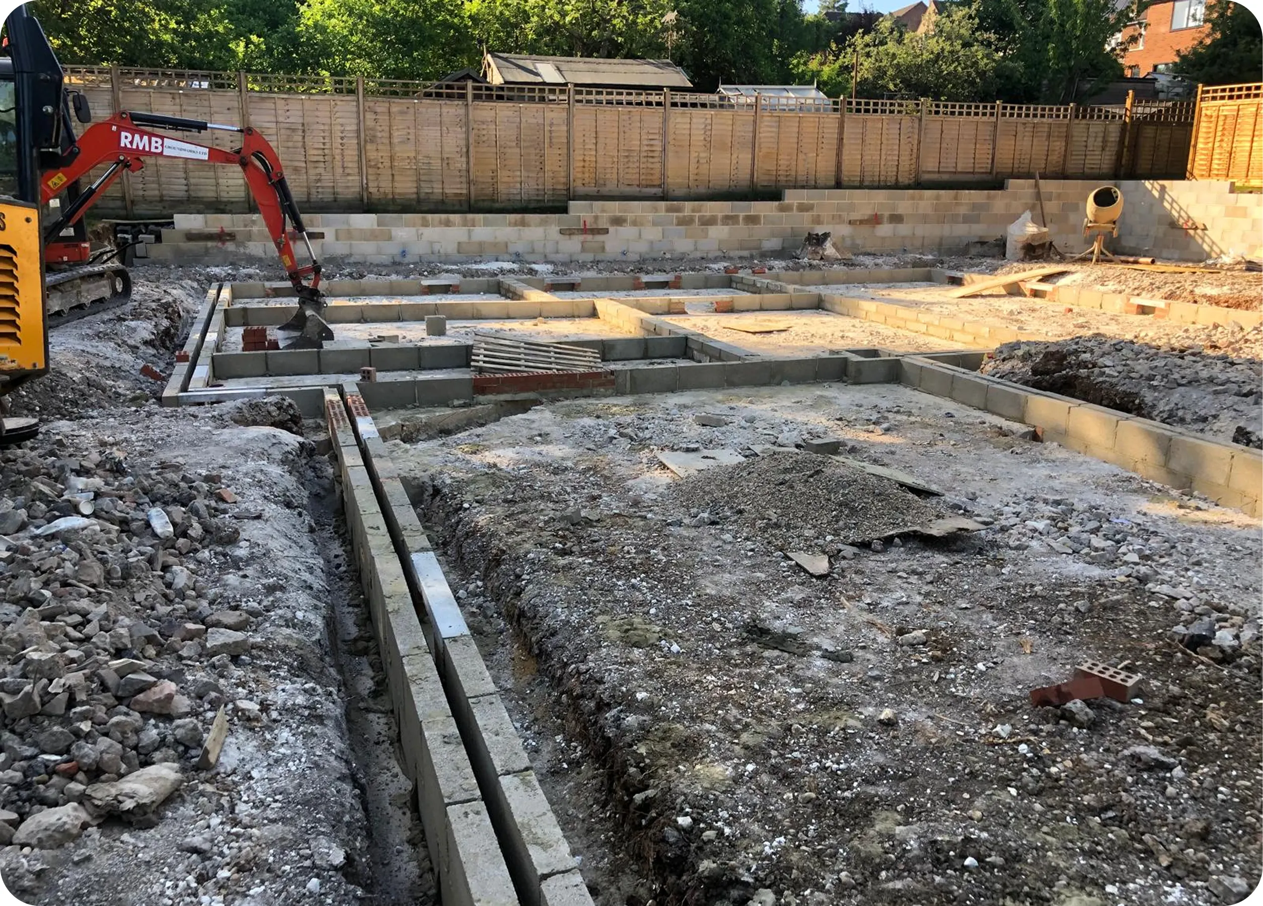 Blockwork foundation walls with an RMB excavator