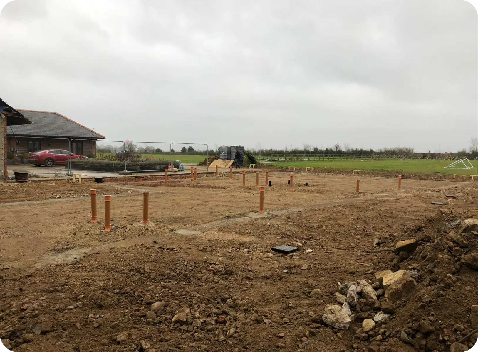 Drainage pipework set out across a new-build plot